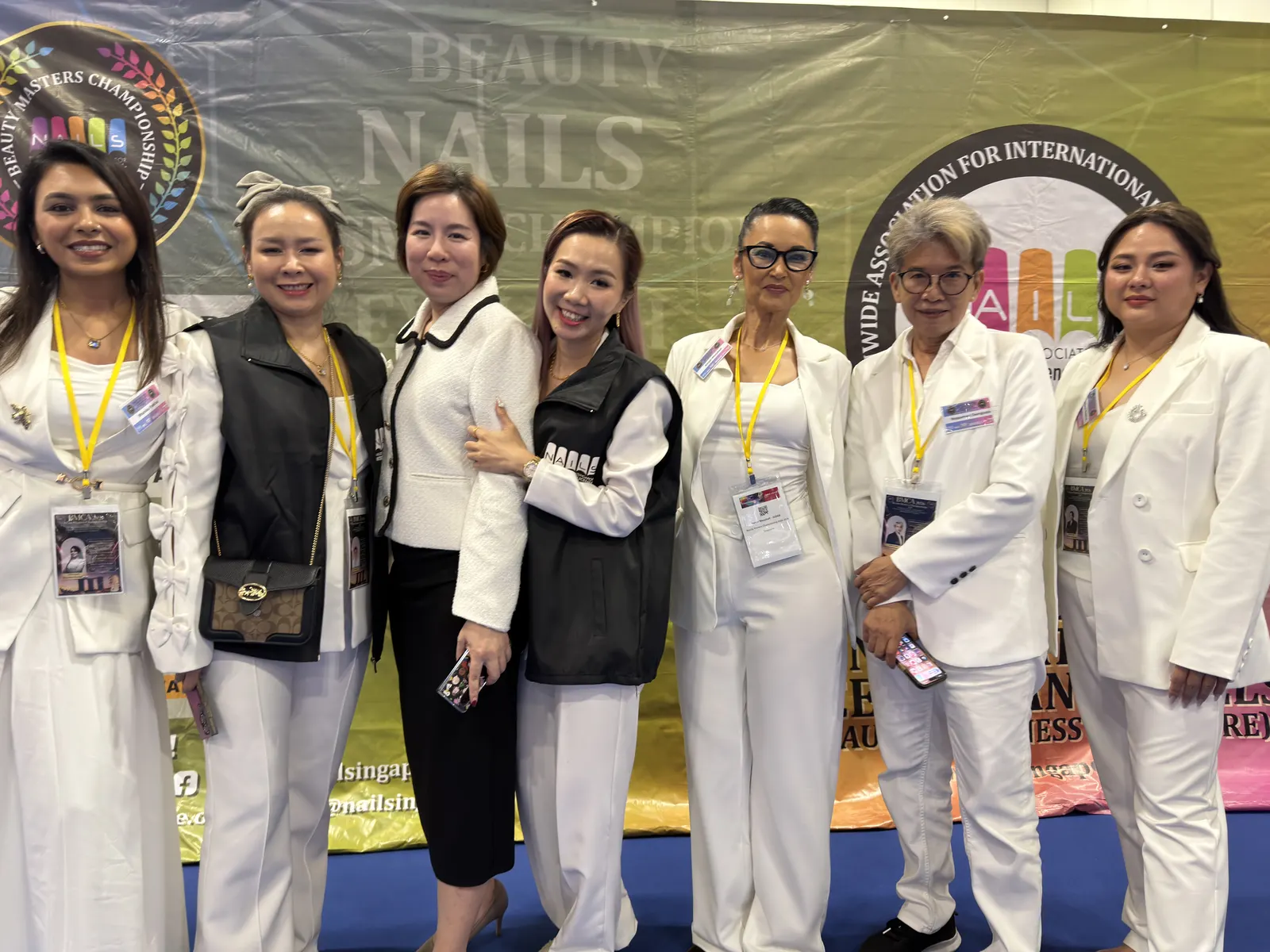 International nail industry judges and professionals together at an Asia championship
