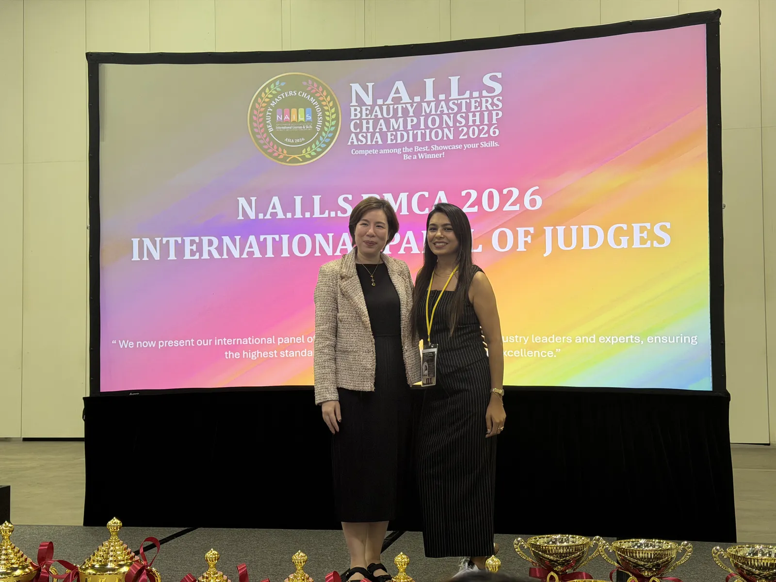 Bhumika Panchal with a fellow international judge at the N.A.I.L.S Beauty Masters Championship Asia Edition