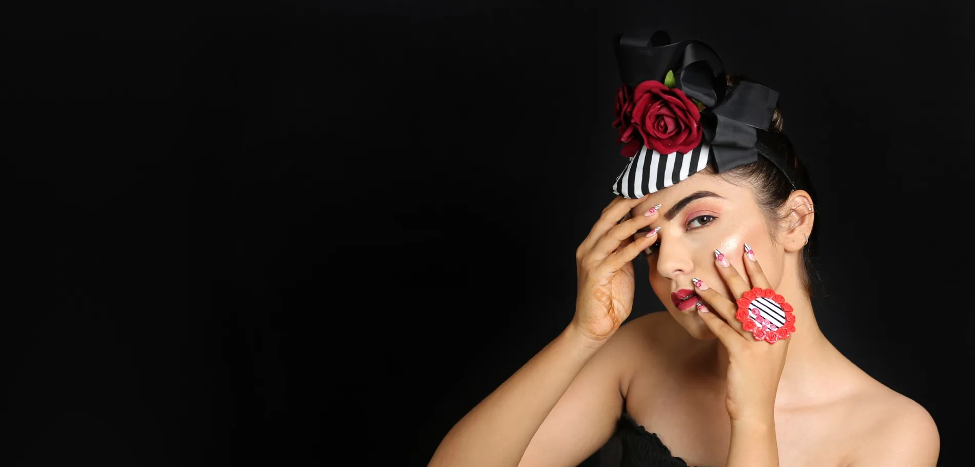 Daisy Nail Studio campaign portrait of a model wearing hand-painted rose nail art