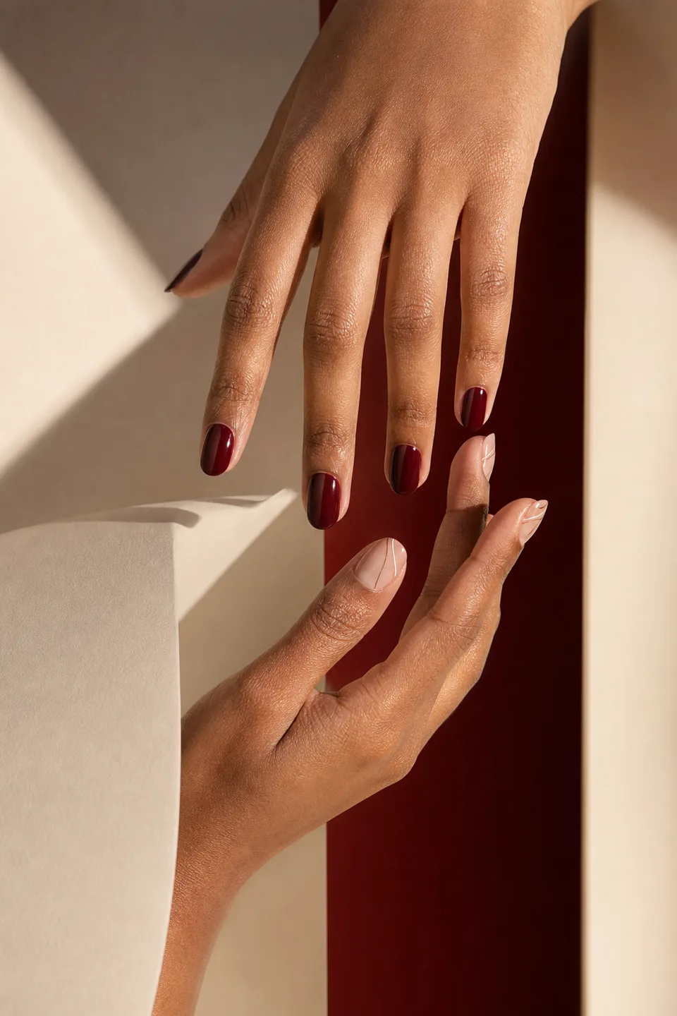 Editorial oxblood manicure and fine line nail art