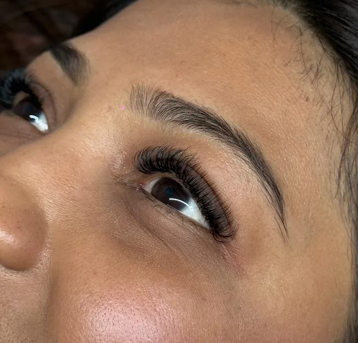 Volume eyelash extensions applied with evenly spaced fans